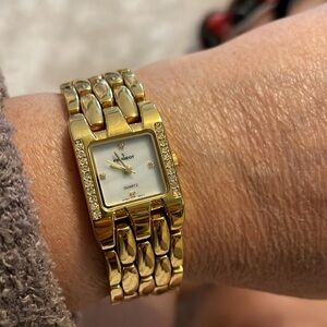 Peugeot goldtone watch for 7 inch wrist or smaller. “Marble” look in the back.